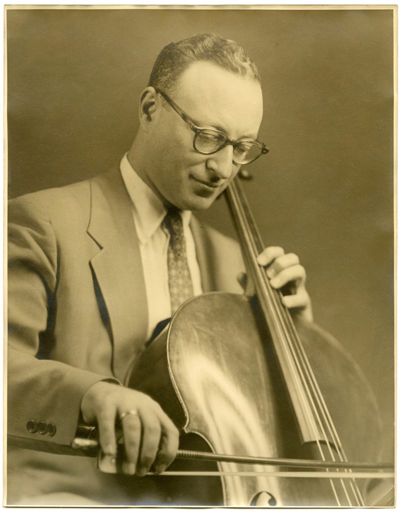Headshot of Alexander Kouguell with his cello